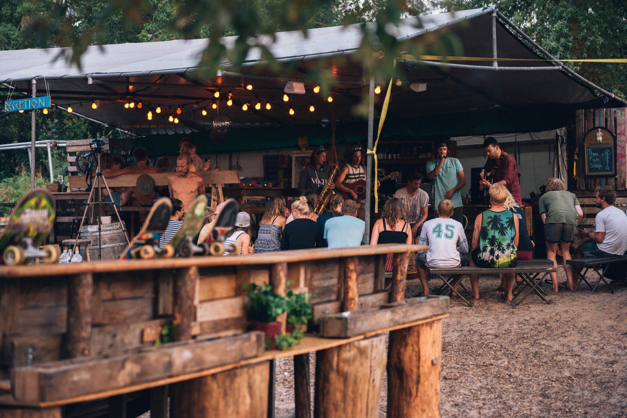 A pear set on a yellow plate upon a soft white canvas texture.